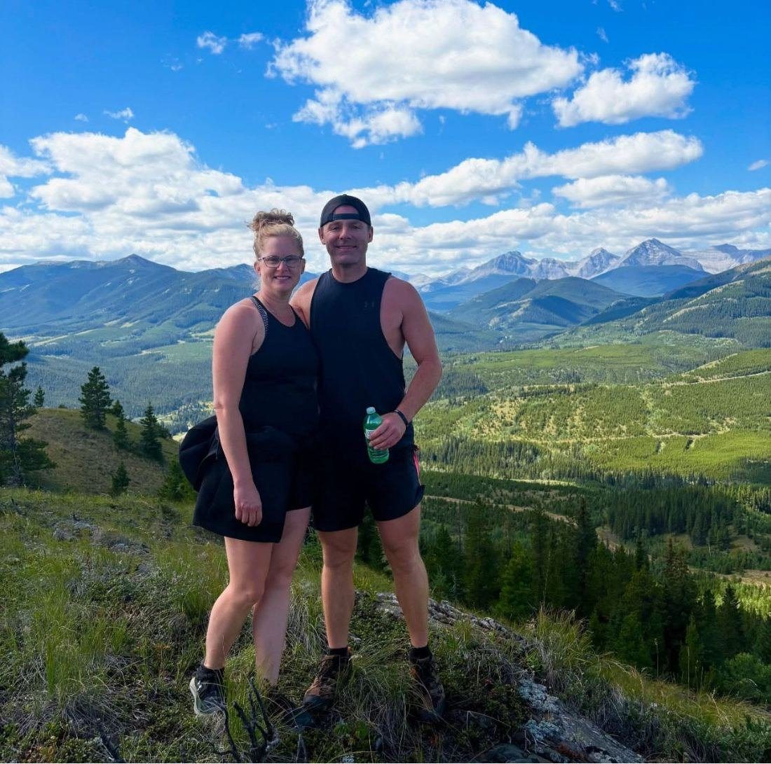 Josh and his wife on a mountain hike