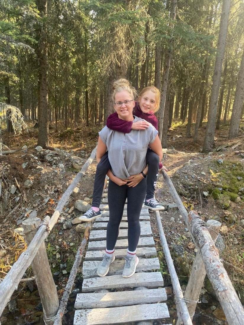 Family walking a forest boardwalk