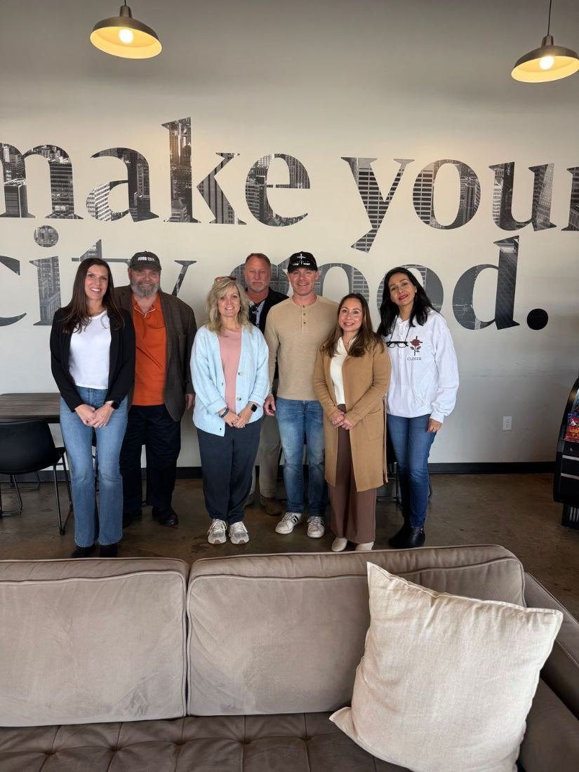 The Stronger Together team at a café